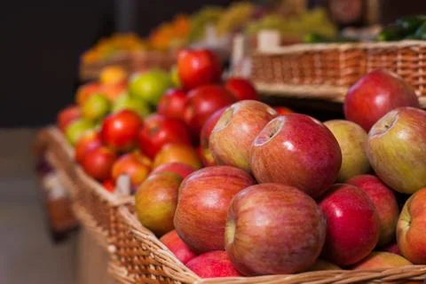 Wicker boxes with ripe apples. Stock Photos