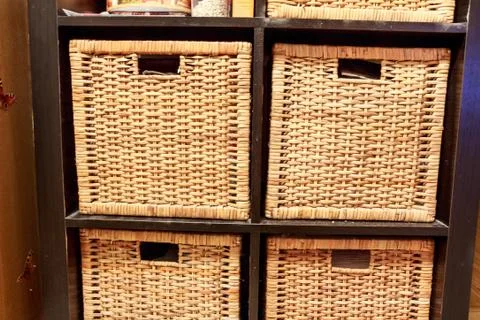 Wicker boxes for storing household objects closeup Stock Photos