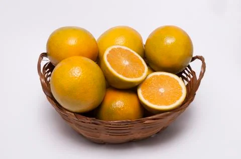 A wicker casket with oranges Stock Photos