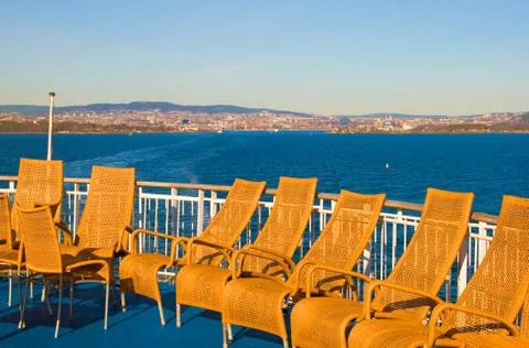 Wicker chairs on the ferry Stock Photos