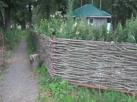 Wicker fence, rustic house Stock Footage 78059942