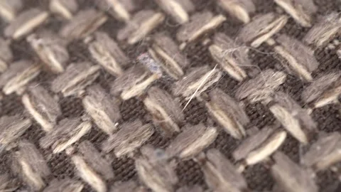 Wicker gray fabric macro. The camera shoots a plaid in the motion of a dolly. Stock Footage 236475835