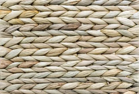 Wicker texture. Background of reed weaving. Rough weaving from straw. Stock Photos