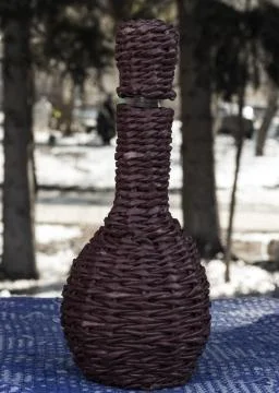 Wicker wine bottle Stock Photos