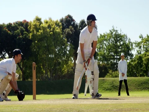 Wicket keeper taking a catch during cricket match Stock Footage 78640263