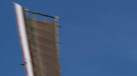 Wicks windmill turning in blue sky - close up Stock Footage 34524922