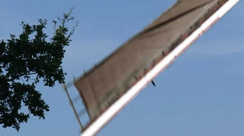 Wicks windmill turning in blue sky - close up Stock Footage 34530541