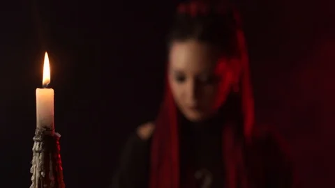 Wicth with braids smiling at camera in smoke Stock Footage 123959563
