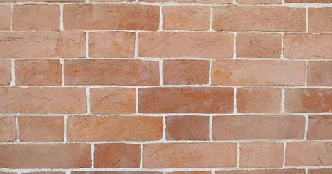 Wide 4K red brick wall background Stock Photos