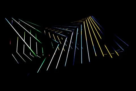 Wide abstract pattern of yellow blue and green light lines Stock Photos