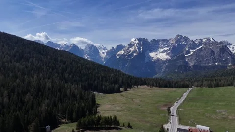 Wide Aerial Drone Push Over Misurina Lake Revealing Tre Cime di Lavaredo Stock Footage 340947080