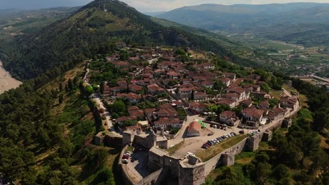 Wide aerial drone view showcasing the historic hilltop settlement and ancient Stock Footage 342291655