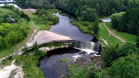 Wide aerial fly-forward over Jägala waterfall Stock Footage 344759565