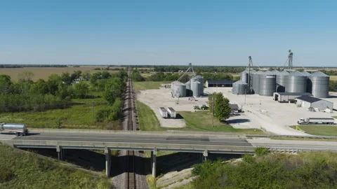 Wide Aerial of Grain Elevator Complex and Highway Bridge Stock Footage 324691186