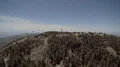 wide aerial high approach to MLO infrared observatory and USAF radar dome HD Footage