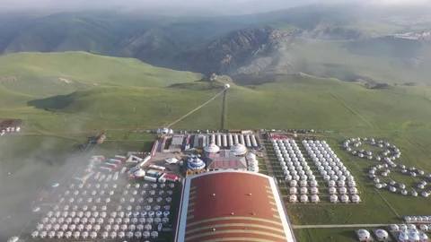 Wide Aerial Of Large Mongolian Yurt Resort In Morning Golden Light Inner Mo.. Stock Footage 337811341