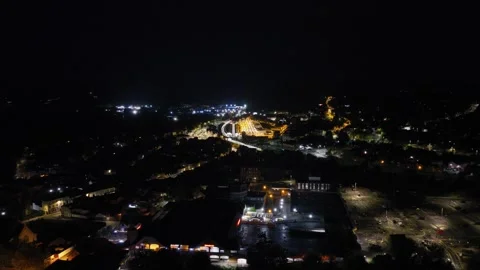 Wide Aerial Night View Over Salisbury Railway Station and City Lights Stock Footage 346611311