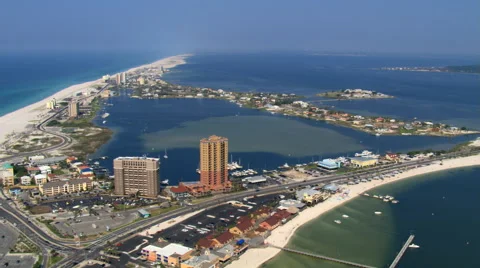 Wide aerial orbit of Pensacola Beach, Florida including beach. Shot in 2007. Stock Footage