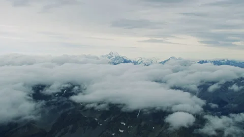 Wide aerial over the clouds towards Mount Cook Stock Footage 154990500