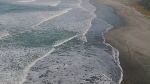 Wide Aerial Over Empty Beach and Rolling Waves on California Coast Stock Footage 333225088