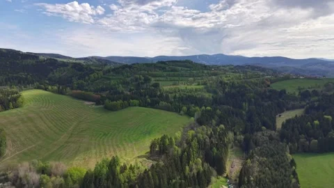 Wide Aerial Panorama of Emerald Rolling Hills Patchwork Fields and Dense Stock Footage 346261618