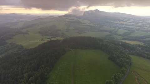 Wide aerial panorama of rolling countryside at sunset with patchwork fields, Stock Footage 346261663
