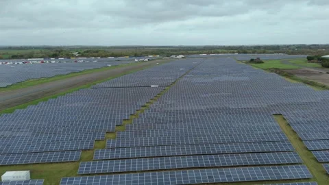 Wide Aerial Perspective of Massive Solar Panel Array Supporting Clean Stock Footage 327714117
