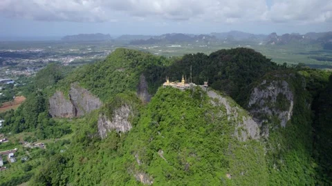 Wide Aerial Perspective of Tiger Cave Temple on Mountain Ridge in Krabi Stock Footage 332609752