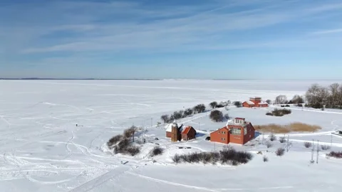 Wide Aerial Pull-Back of Ventė Cape and Frozen Lagoon Landscape 스톡 동영상 331050388