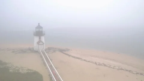 Wide Aerial Pull-Out of Brant Point Lighthouse During Fog, Nantucket. Stock Footage 88016312