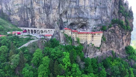 Wide Aerial Pullback Revealing Historic Cliffside Monastery Stock Footage 340430176