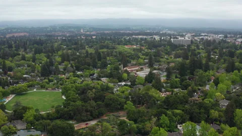 Wide Aerial pullback shot of Menlo Park and Palo Alto in California cloudy Stock Footage 308244258