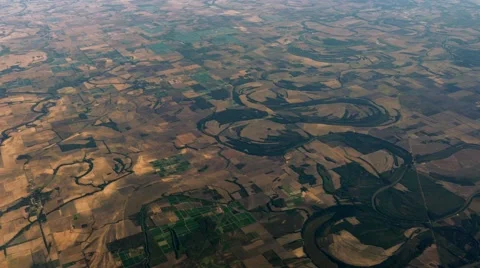 Wide Aerial of River winding through Crop Fields, 4K Stock Footage 56221207