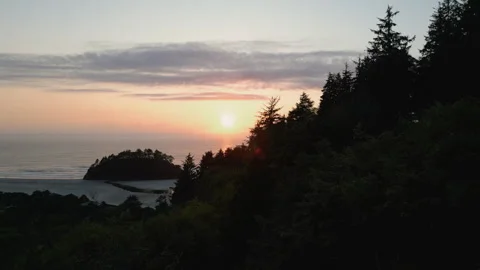 Wide aerial shot approaching Proposal rock at Neskowin beach at Sunset Stock Footage 249028455