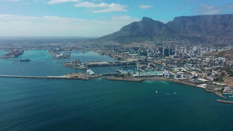 Wide aerial shot tracking forward into the city of Cape Town during a Stock Footage 148989905