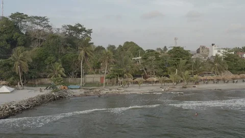 Wide aerial strafes down length of the Necocli beach in coastal Colombia Stock-Footage 107988098