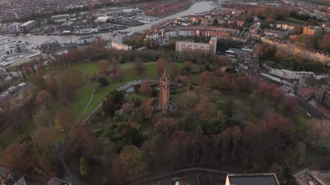 Wide aerial tilting down over Cabot Tower and Brandon Hill in the city of 스톡 동영상 250792138
