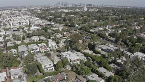 Wide aerial tilting up shot of Downtown Los Angeles from Highland Ave. and Stock Footage 208832653