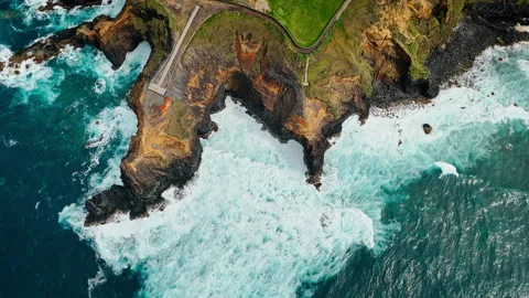 Wide aerial view of Atlantic waves along volcanic coastline of Azores Stock Footage 340068822