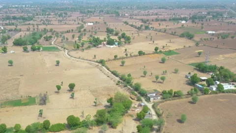 Wide Aerial View of Dry Fields and Scattered Houses near Jojawar Stock Footage 314974407