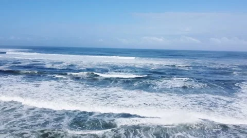 Wide aerial view of endless ocean waves Rolling waves heading towards the sho Stock-Footage 322519956