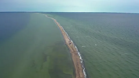 Wide aerial view of a group exploring the natural beauty of the Puck Bay Stock Footage 335031635