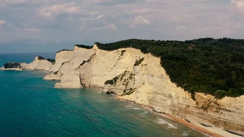 Wide Aerial View Of Logas beach cliffs in Peroulades. Greece Stock Footage 112247637