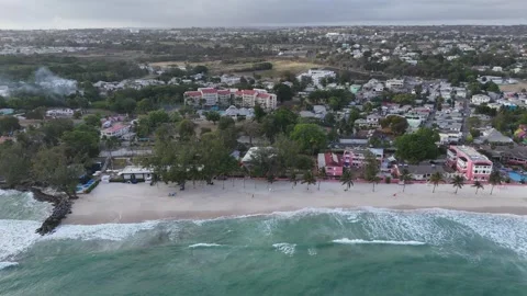 Wide aerial view over the sandy coastline of St Lawrence Gap beach, showing 스톡 동영상 336695729