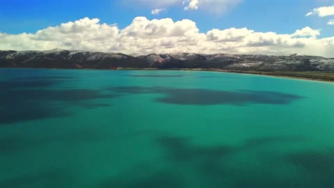 Wide aerial view over turquoise water at Bear Lake Utah Stock Footage 335080898