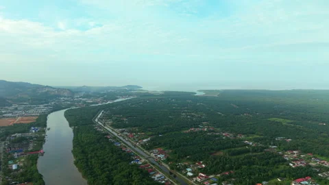 Wide Aerial View of River Flowing Through Mangrove Landscape Toward Coast Stock Footage 325569129