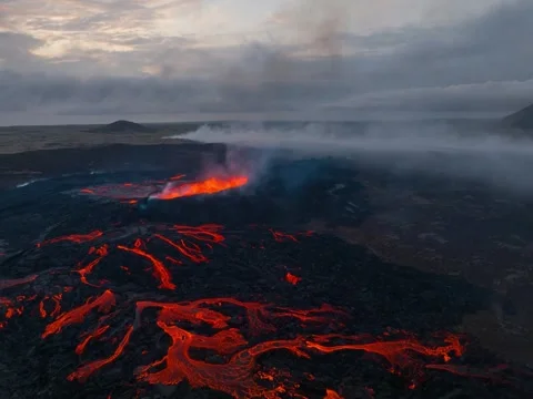 Wide Aerial Volcanic Field with Multiple Flowing Lava Streams in Mist 스톡 동영상 322182745