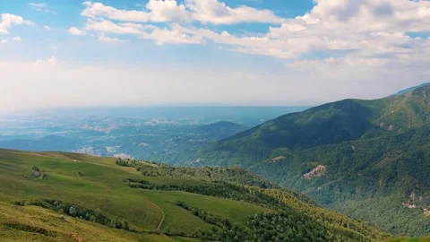 Wide alpine valleys and ridges panorama with blue haze on horizon Stock Footage 336131262