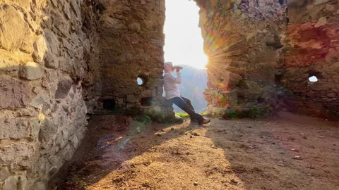 Wide angle 4K video shot of warm clothed tourist woman drinking hot during walk Stock-Footage 222593790