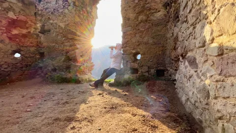 Wide angle 4K video shot of warm clothed tourist woman drinking a hot during fro Stock-Footage 233966622